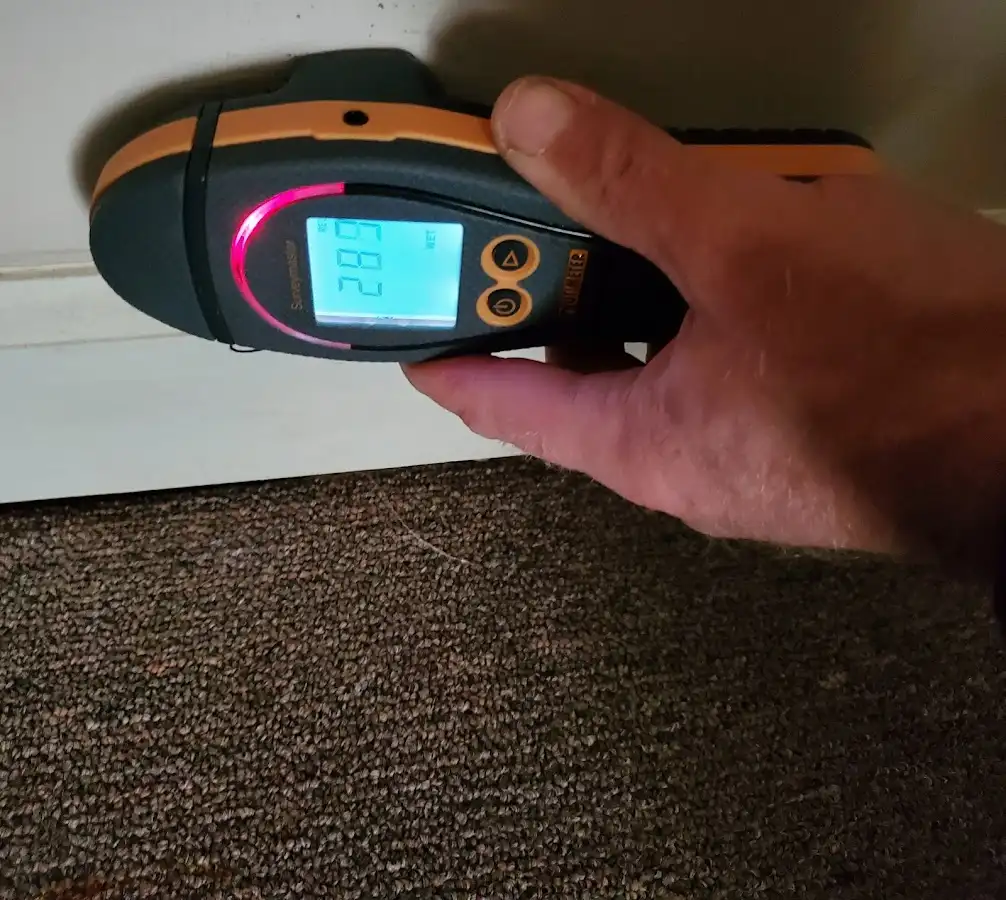Moisture detection at baseboard during Storm Damage Restoration in Herriman